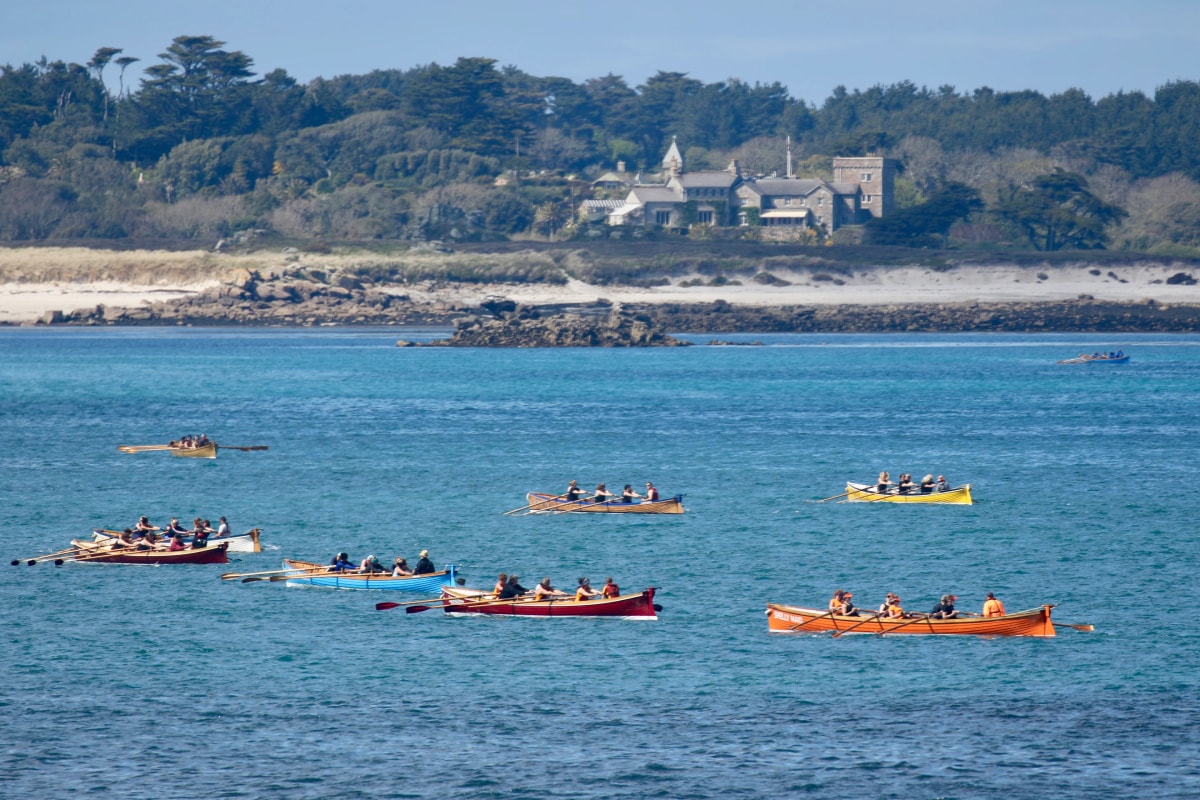 Pilot gigs on the sea between the islands off Tresco, Isles of Scilly