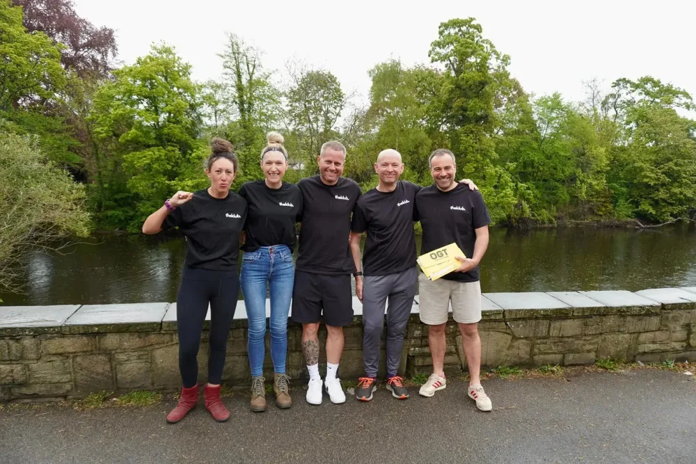 theKlub hosts and team together after a trip