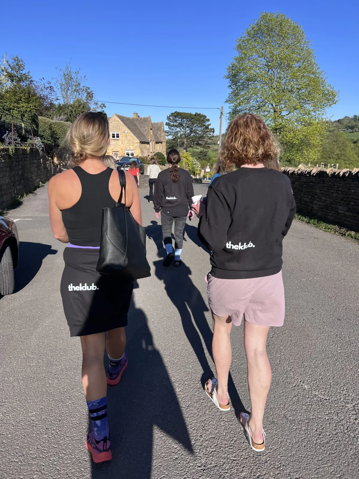 theKlub team walking through a village in klub kit